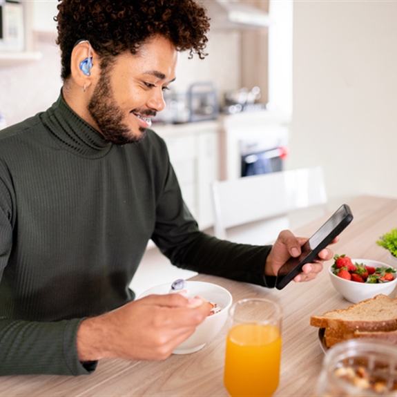 Hearing impaired man using his phone